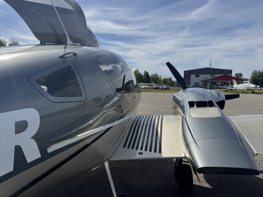 Close up of the wing and fuselage of a Diamond DA62 aircraft.