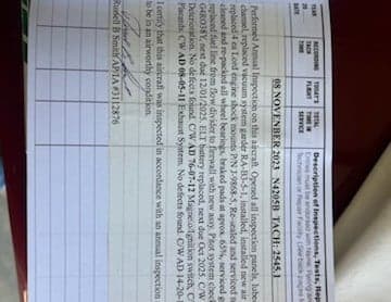 Close-up of aircraft inspection documentation.