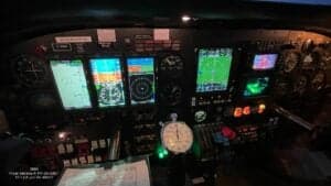 The instrument panel of a Piper Seneca III PA-34-220T aircraft with multiple displays.