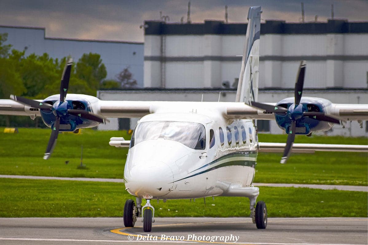 A Tecnam P2012 Traveller on the tarmac, front view.