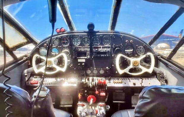 The cockpit of the Lockheed Model 10 Electra features dual control wheels and a full instrument panel.