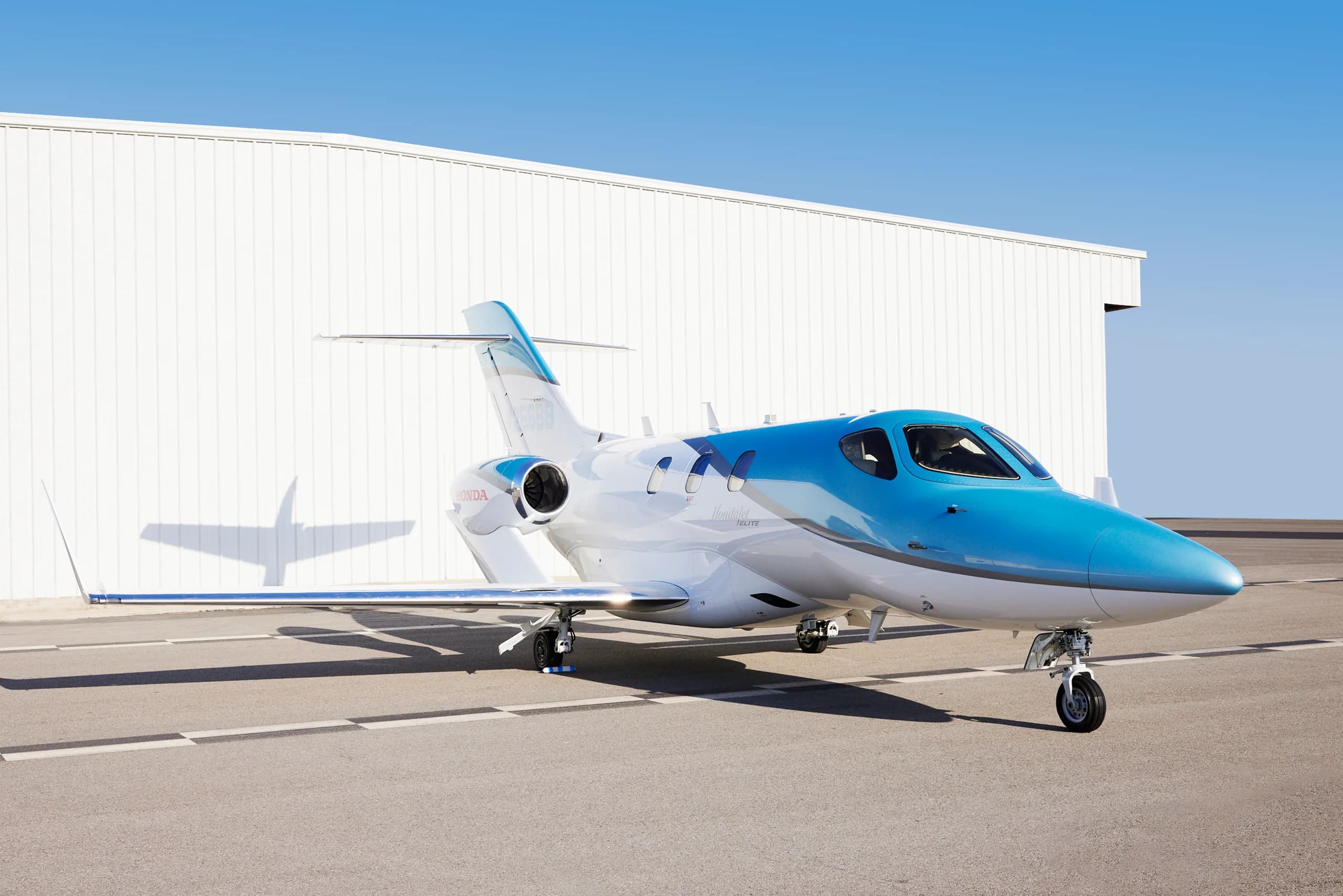 Side view of a HondaJet Elite on the tarmac.