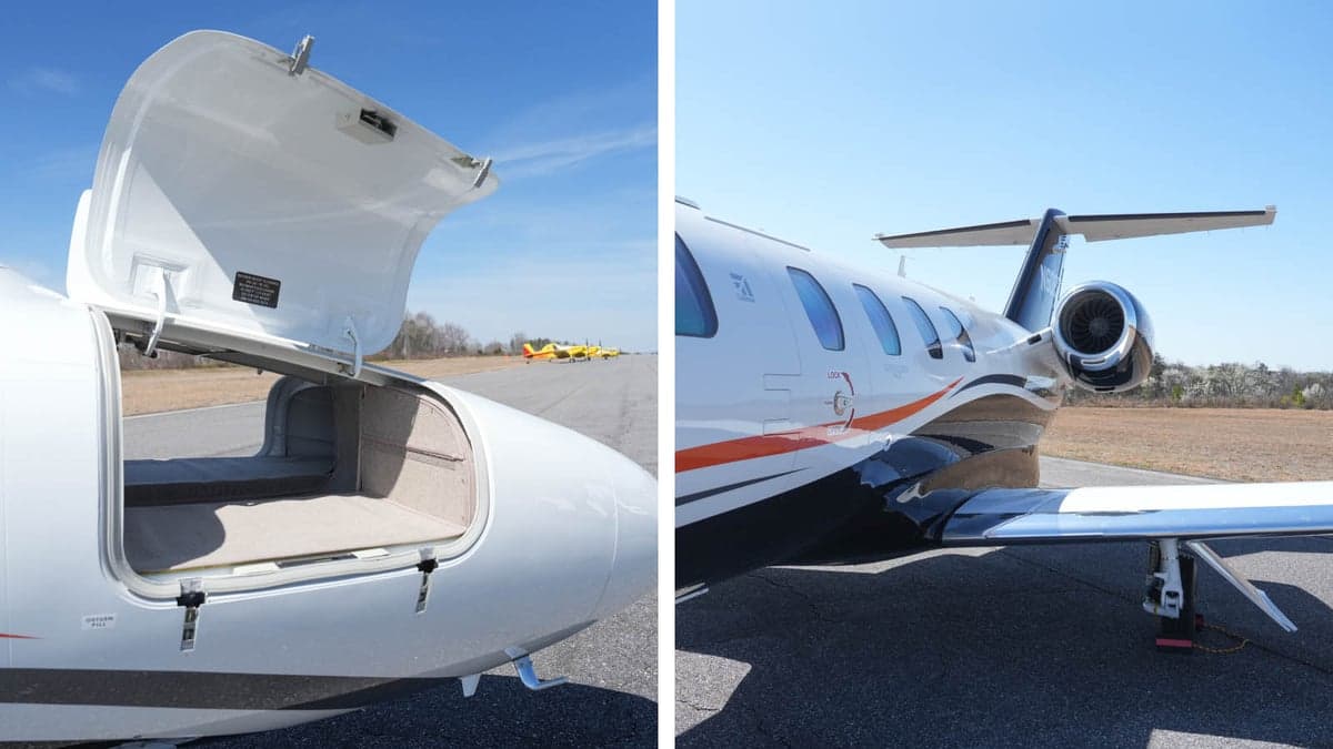 The aircraft's open baggage compartment and tail section are shown on the tarmac.