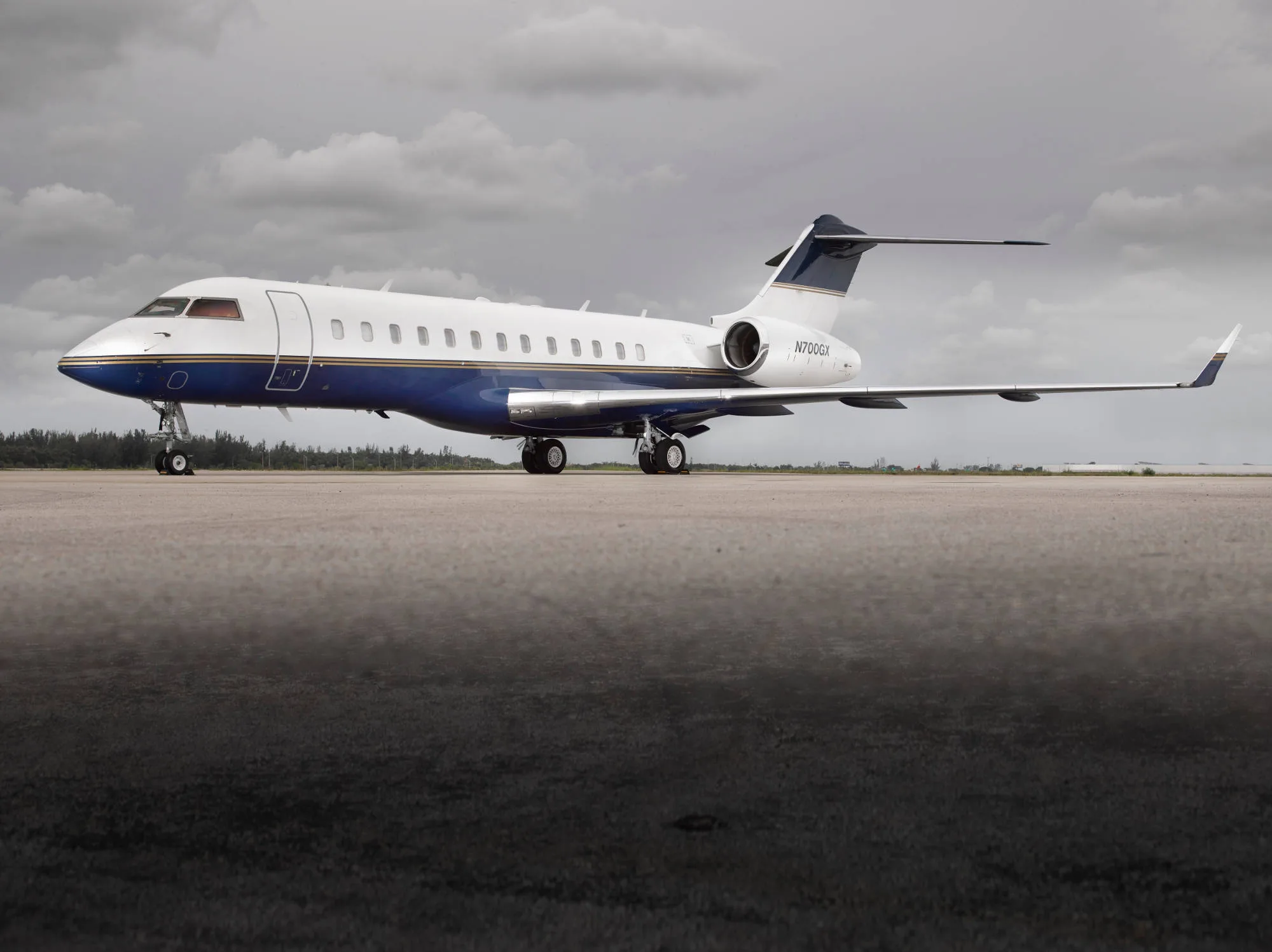 N700GX Bombardier Global Express on the tarmac with a blue and white paint scheme.