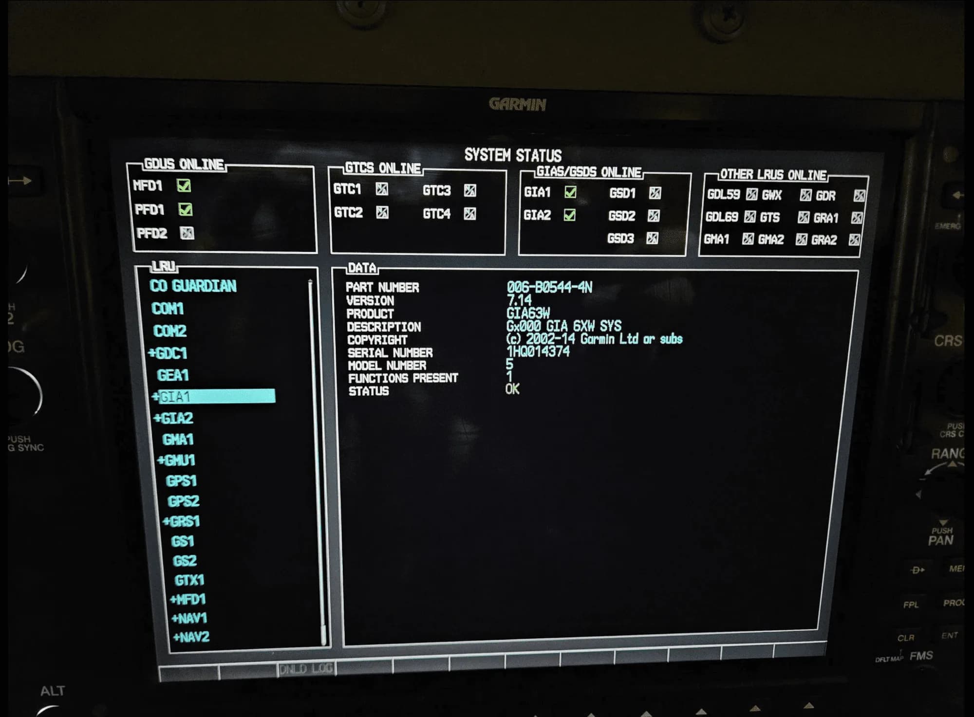 A close-up of an aircraft's Garmin system status display showing avionics and LRU data.