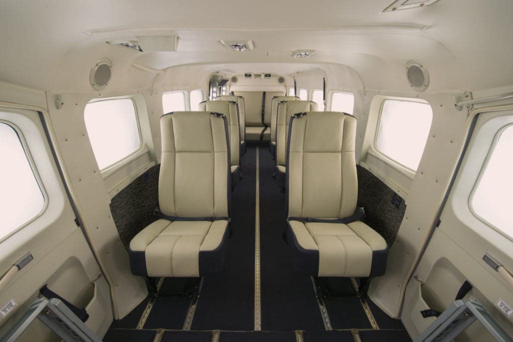 The interior of a Cessna Caravan with light-colored seats.