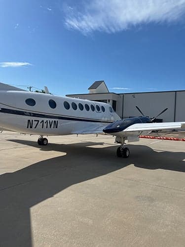 Close up of King Air aircraft N711VN showing the registration number.