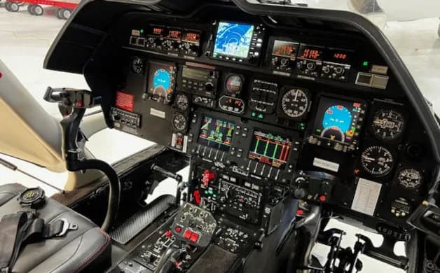 Detailed view of the helicopter's instrument panel and cockpit controls.