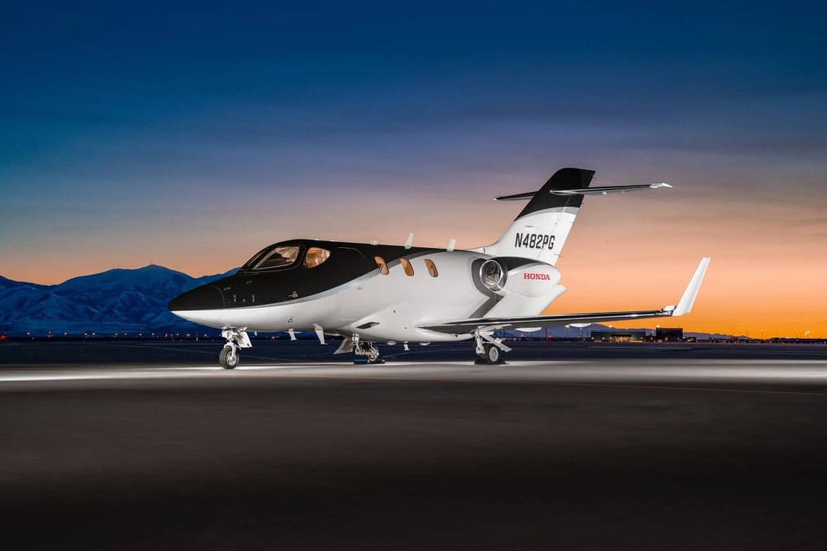 N482PG HondaJet on the tarmac at dusk, showing the tail number and Honda logo.