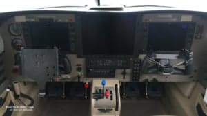 A detailed view of the instrument panel in the cockpit of a Piper PA46-350P Mirage, registration SP-NAZ.