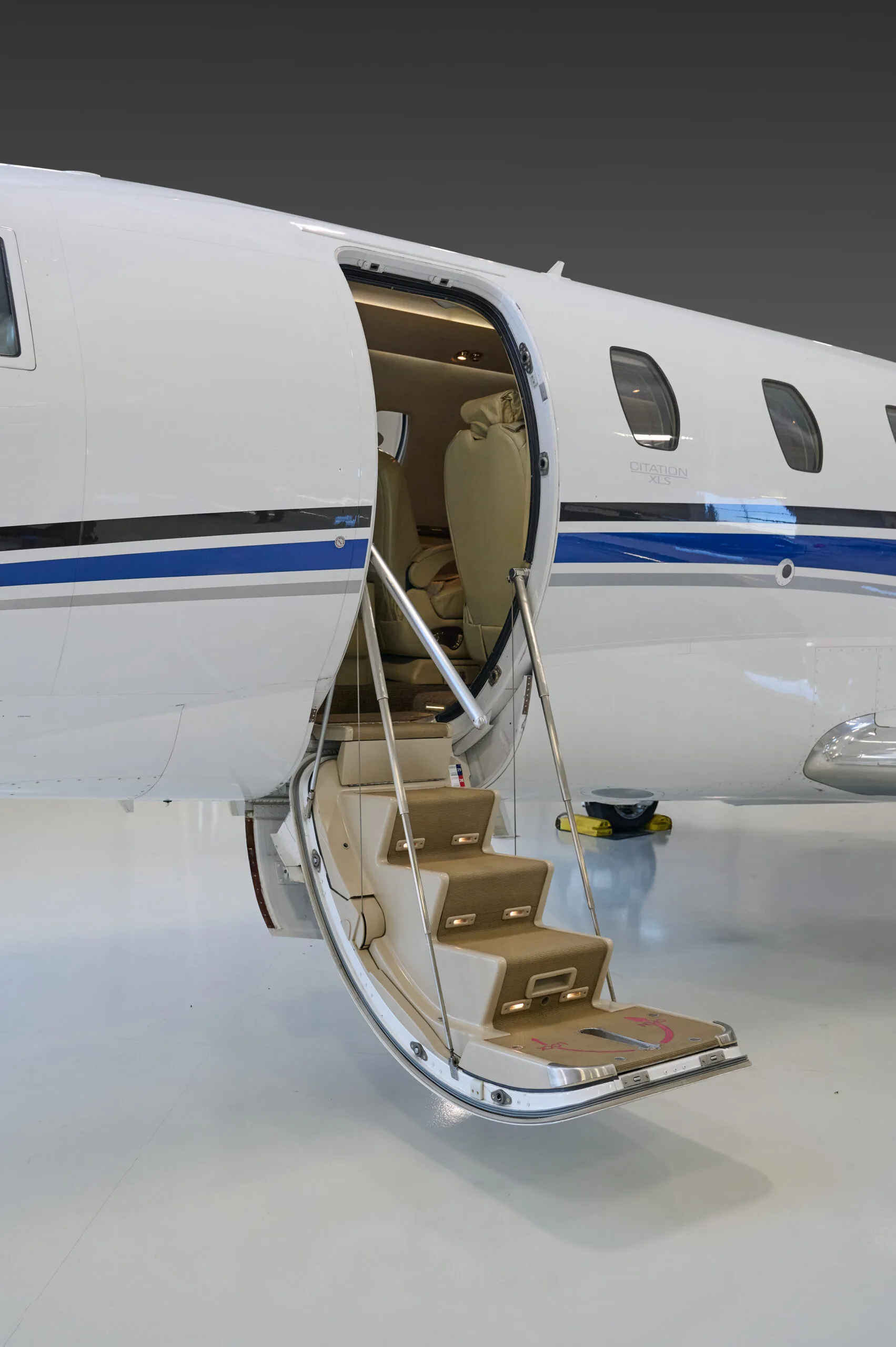 Close-up of the Cessna Citation CJ3 entrance stairs and open door.