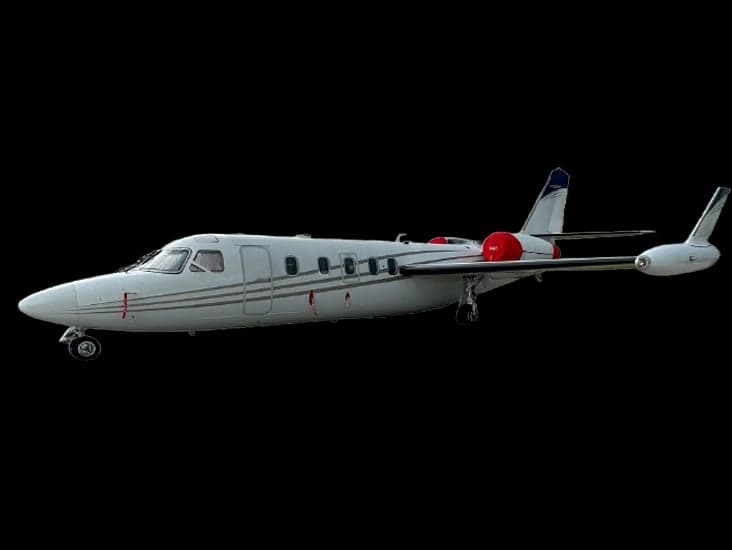 Side view of a white Cessna CitationJet/M2 with red engine nacelles.