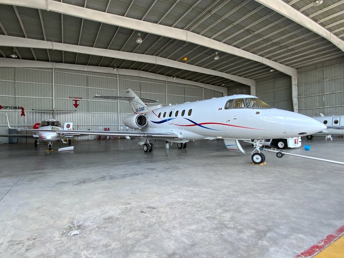XA-DAR Falcon 50 parked in a hangar.