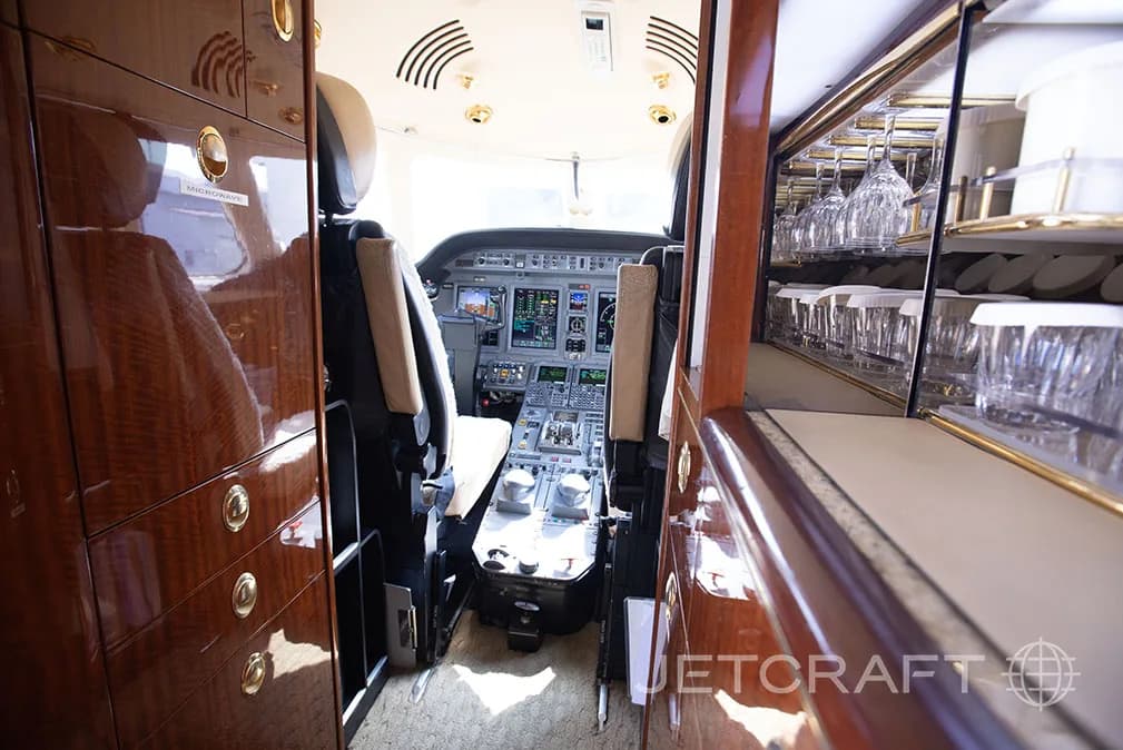 View of the cockpit from the galley area of the jet.