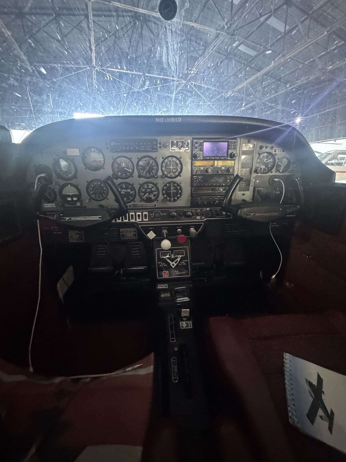 The instrument panel and controls inside the cockpit of an aircraft.