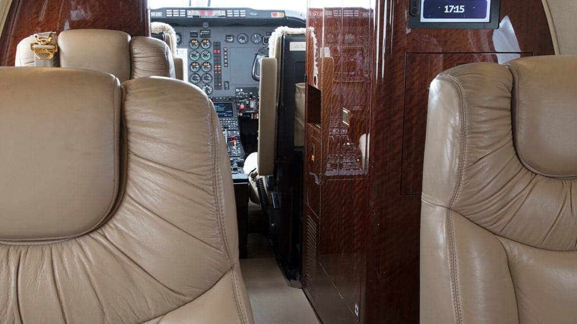 View of the aircraft's interior, showing the seating arrangement and cockpit.