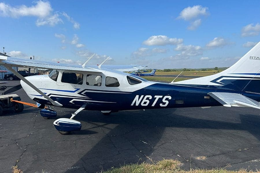 N6TS Cessna aircraft on the tarmac, side view.