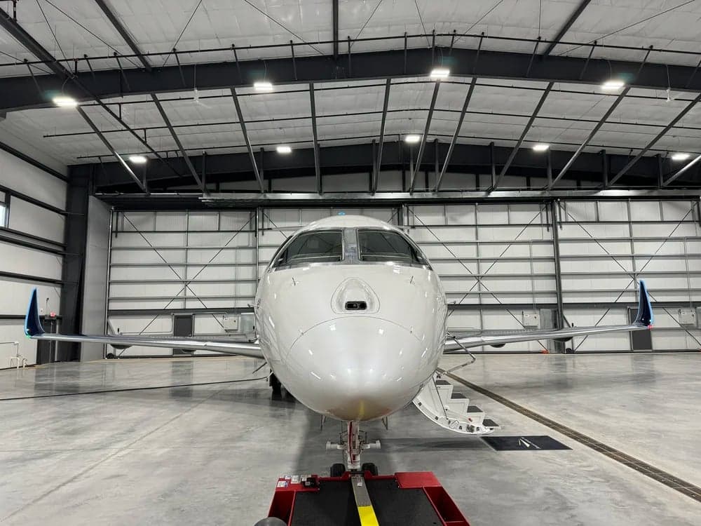 N602EE Praetor 600 aircraft in a hangar, front view.