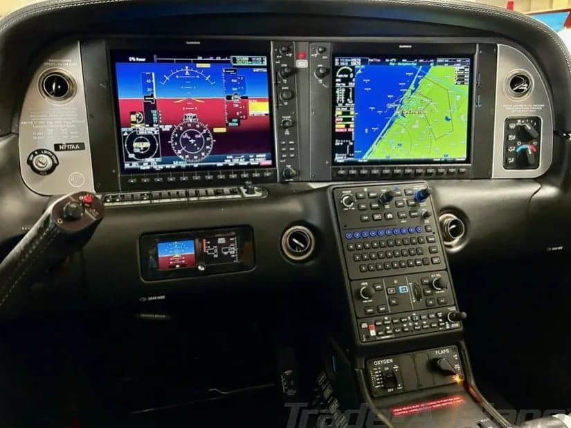 The cockpit of the aircraft features a modern glass panel display.