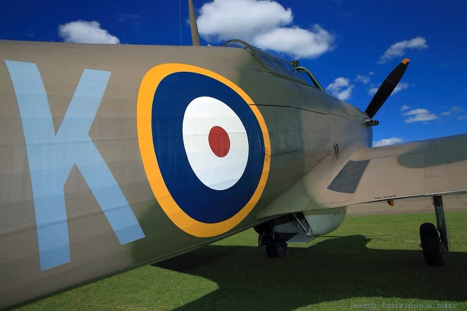 Hawker Hurricane fighter parked on a grassy field.