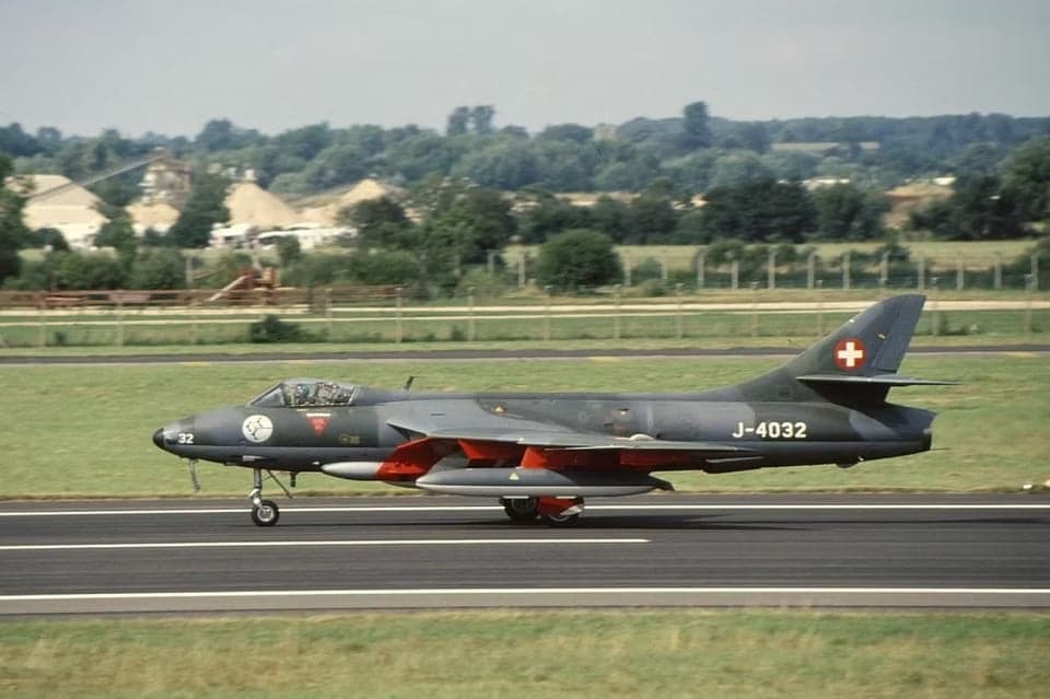 Hawker Hunter J-4032 parked on the tarmac with Swiss Air Force markings.