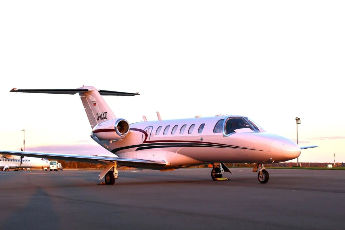 Cessna Citation CJ1+ aircraft with registration D-IXXO on the tarmac.