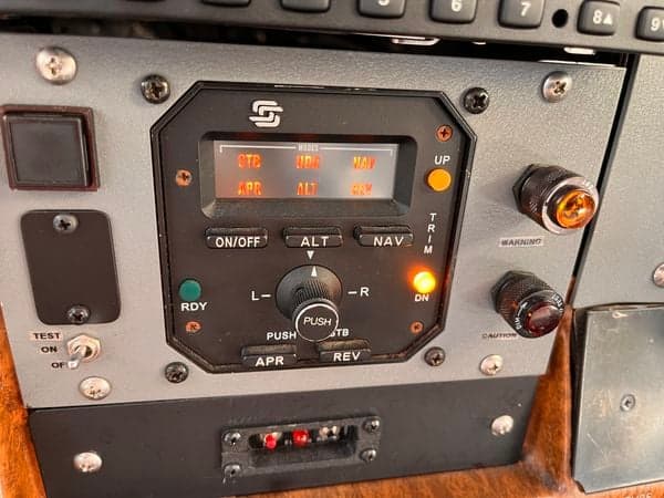 Close-up of the autopilot controls in the cockpit of N738JZ.