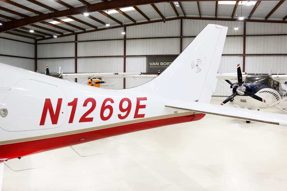 Close up of the tail of a Columbia 350 aircraft with the registration number N1269E.