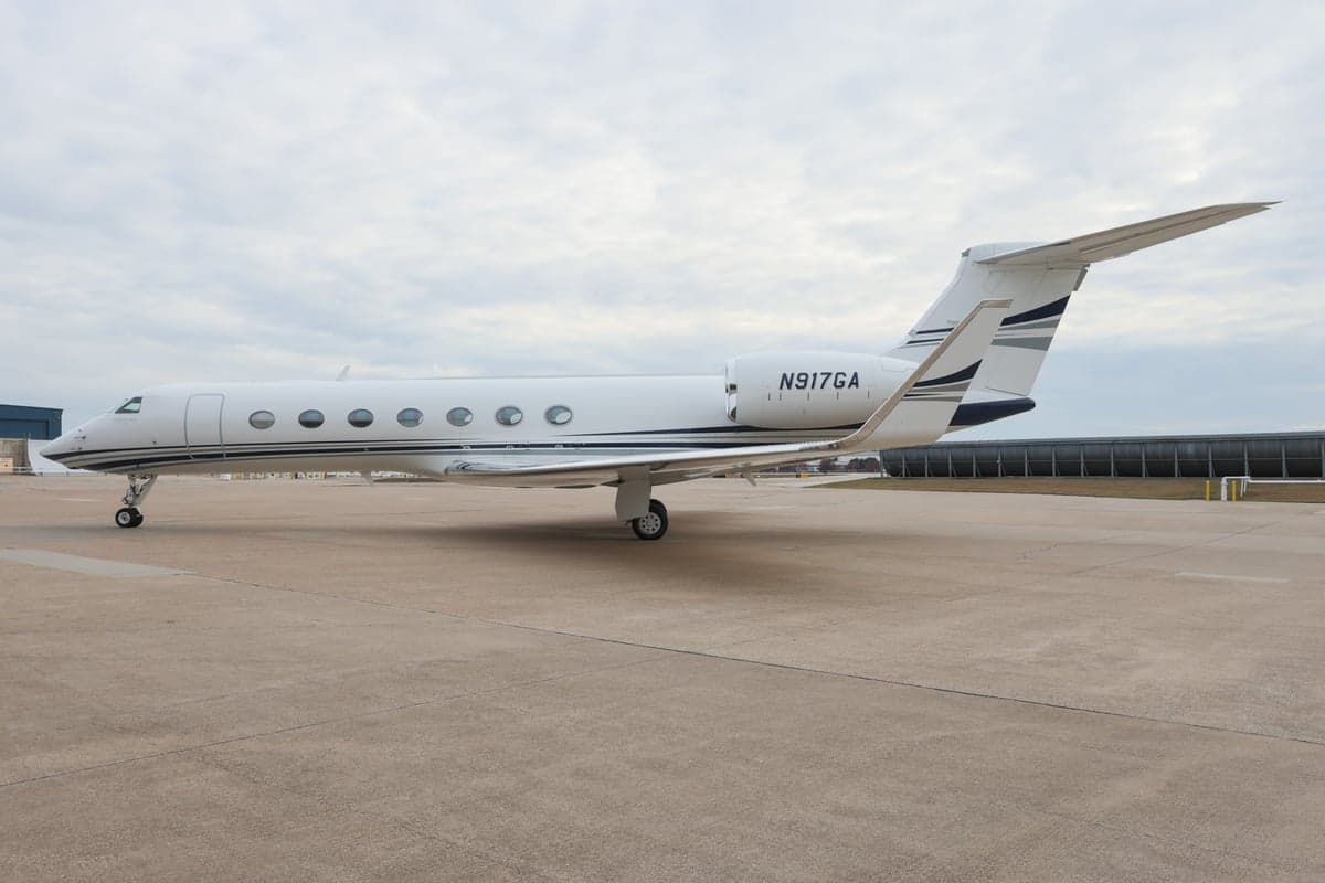 Gulfstream G550 aircraft N917GA parked on the tarmac.