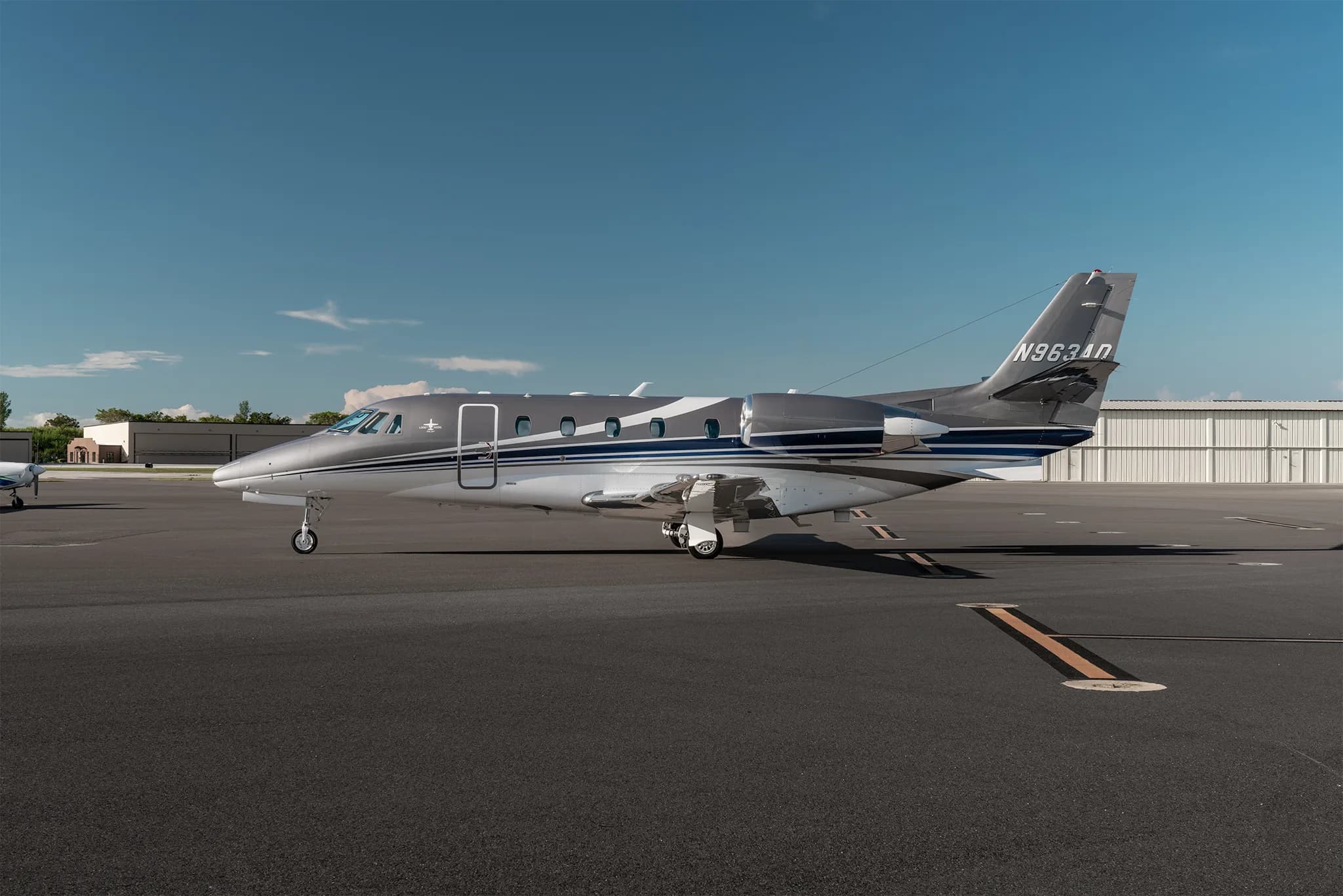Side view of a Cessna Citation XLS+ aircraft on the tarmac.