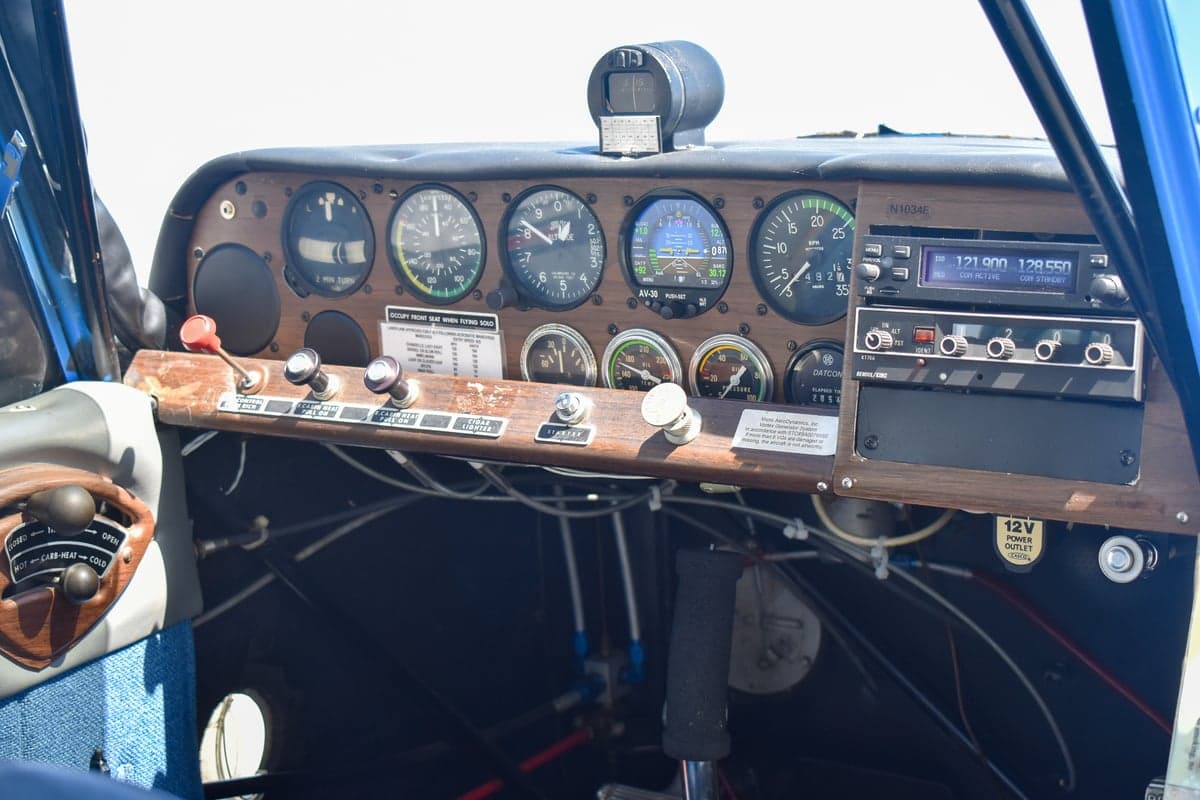 View of the cockpit and interior of the aircraft with the door open.