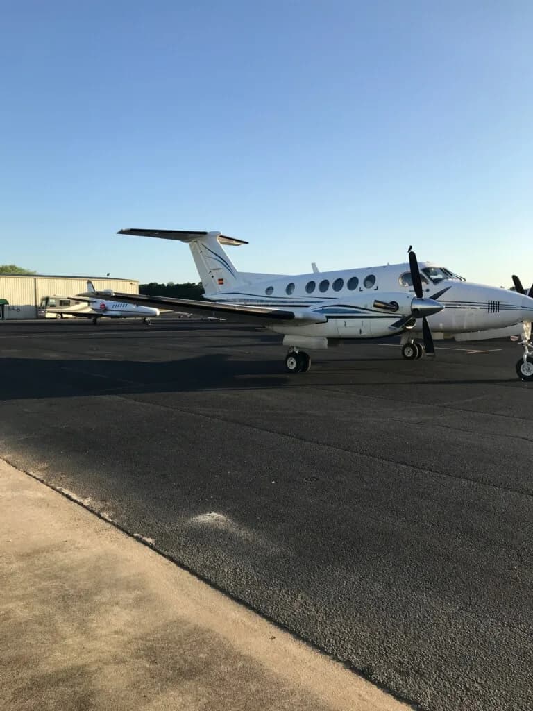 A King Air aircraft parked on the tarmac.