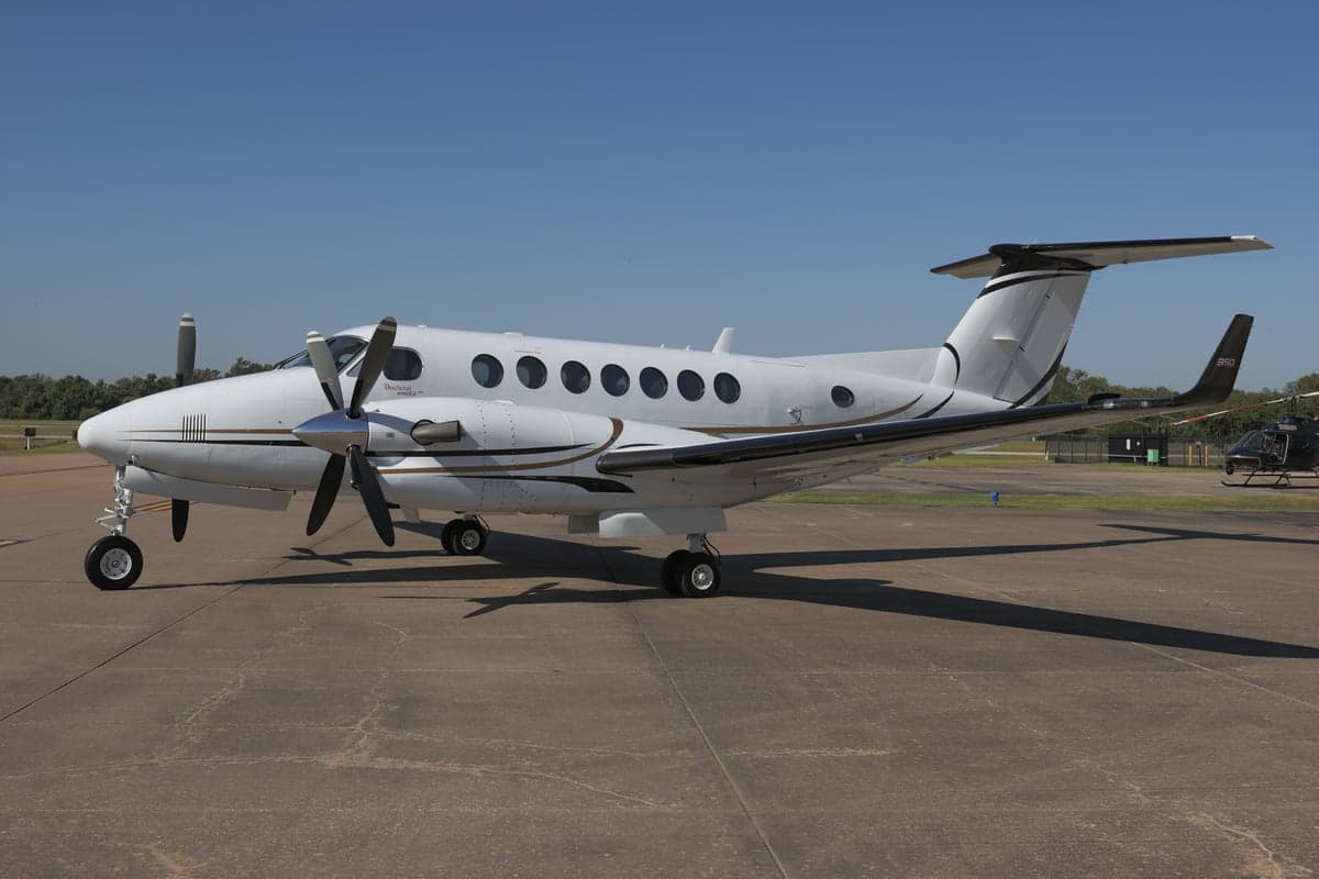 King Air 350 with registration N715LH parked on the tarmac.