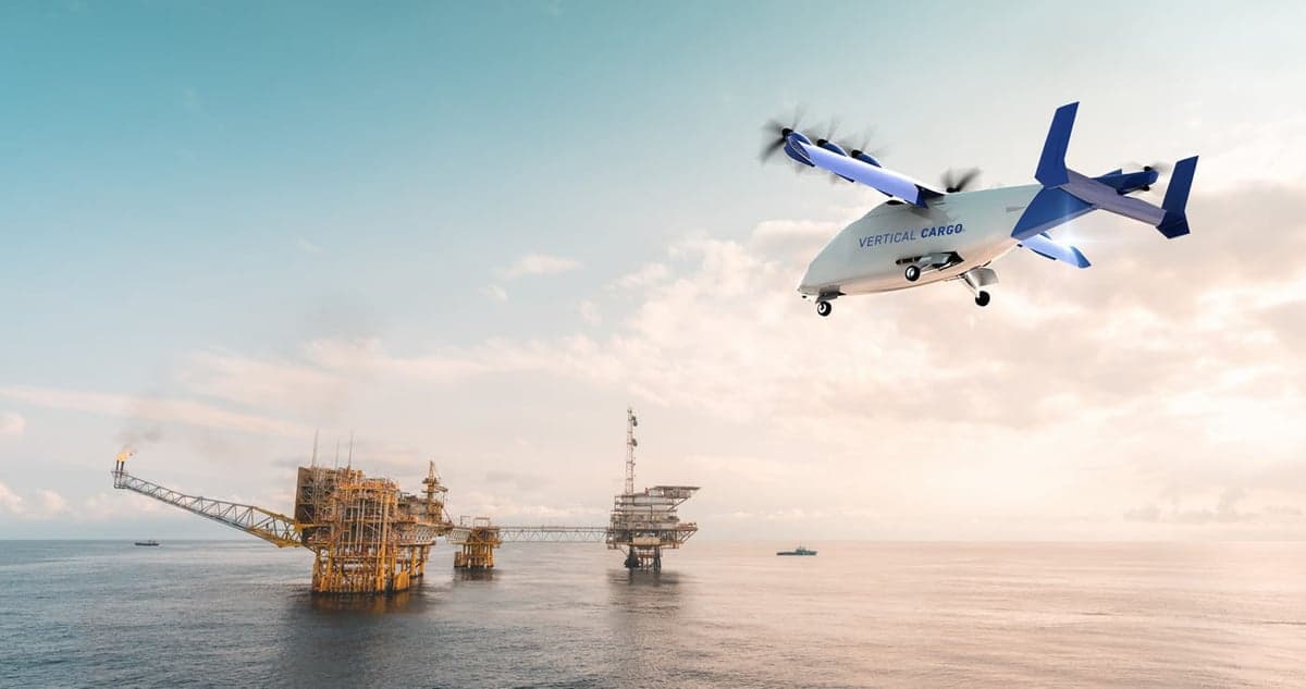 A Vertical Cargo aircraft flying over an oil rig.