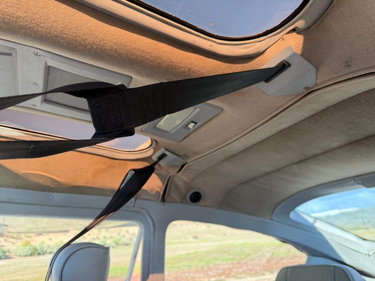 Interior ceiling and seatbelts of the aircraft.