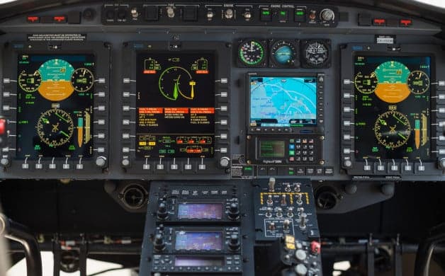 Close-up of three seats inside the helicopter cabin.