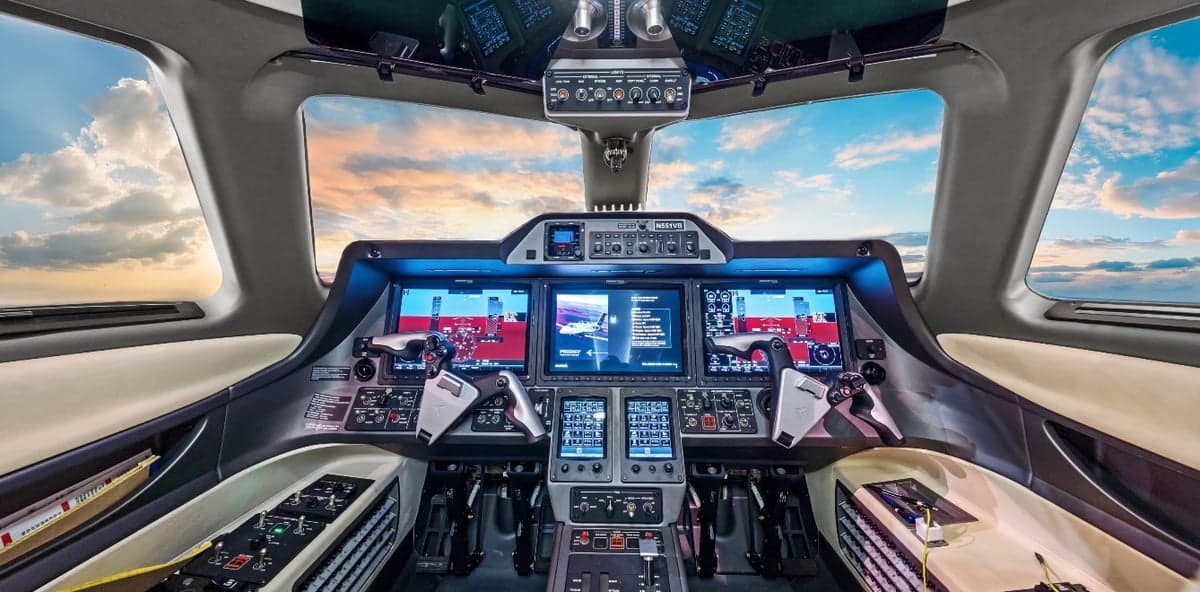 The cockpit of a Phenom 300 aircraft with advanced avionics.