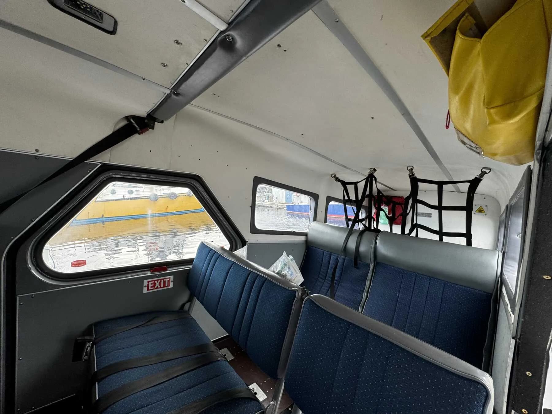 View of the rear passenger seats inside the aircraft cabin.