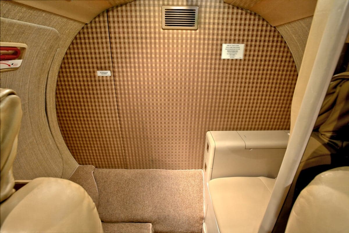 The rear of the CitationJet's cabin features a patterned wall.