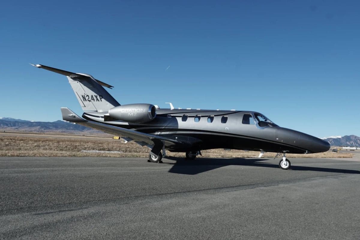 A Citation M2 jet parked on the tarmac.