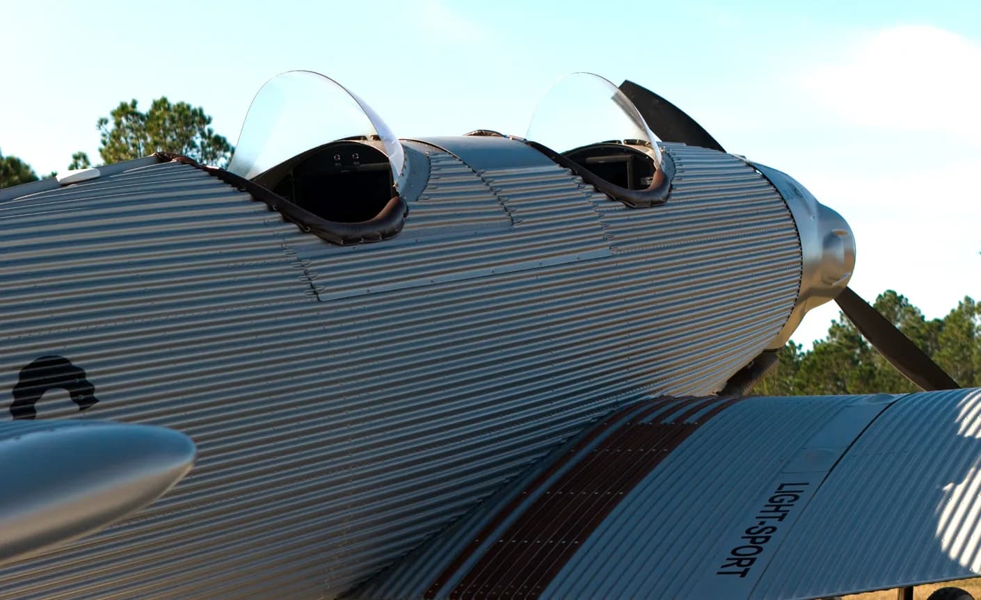 Side view of a Junkers aircraft showing the open cockpit and corrugated metal skin.