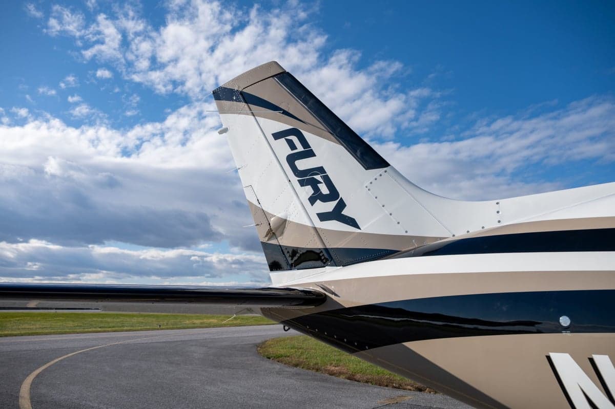 Close up of the tail of the Fury M700 aircraft with the word "FURY" on it.