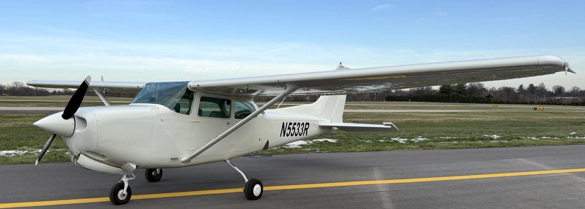 A Cessna 172 aircraft with tail number N5533R parked on the tarmac.