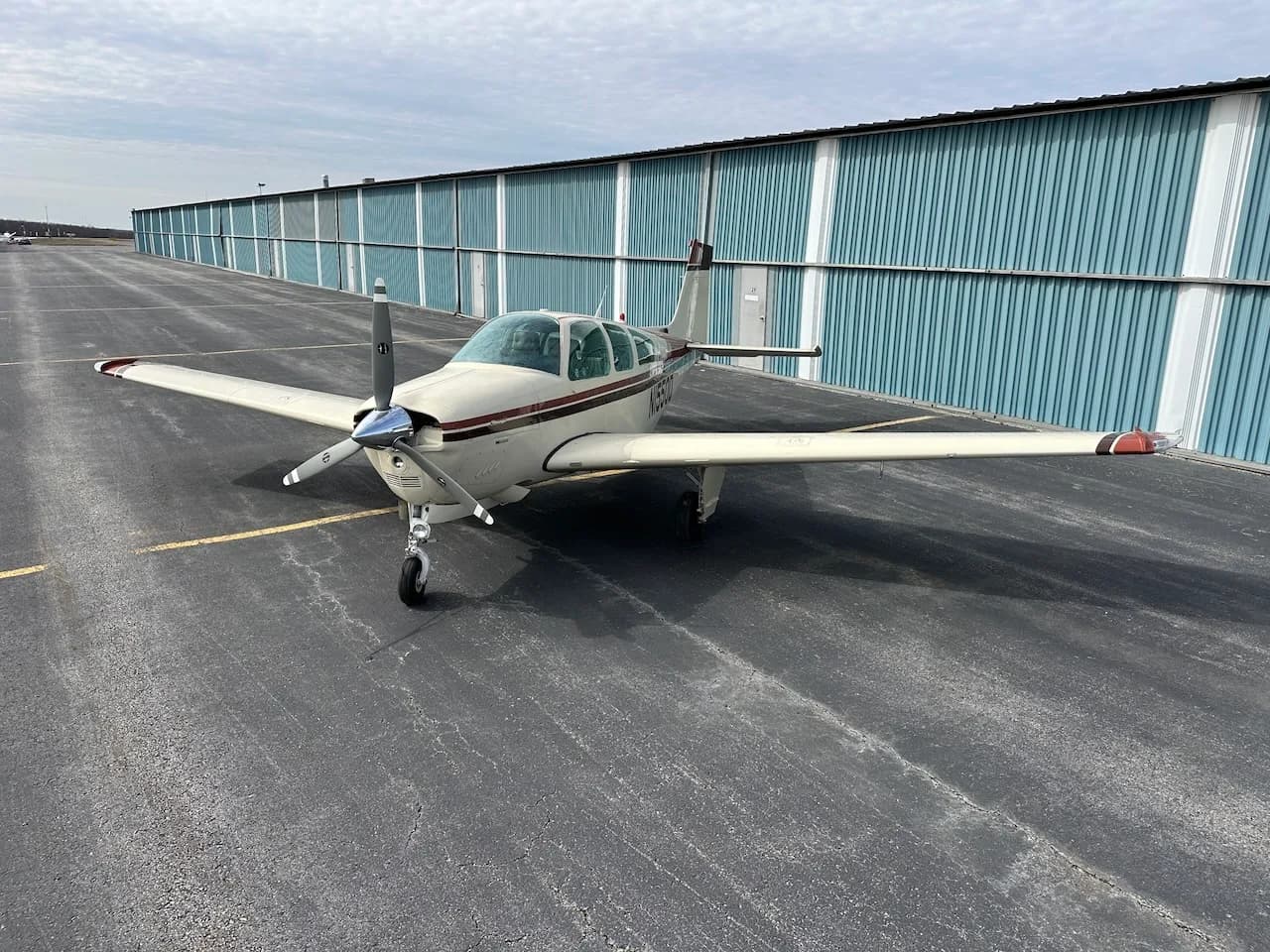 Front view of a Beechcraft Bonanza N1550D on the tarmac.