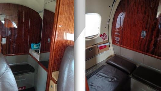 The interior of the Learjet aircraft features wood trim and a small lavatory.