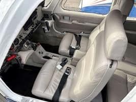 View of the front seats and cockpit area of the aircraft.