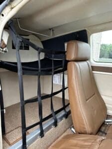 Interior of the Beechcraft Bonanza showing the cargo net.