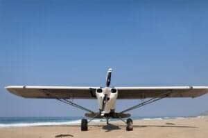 Front view of N864G aircraft on a beach.