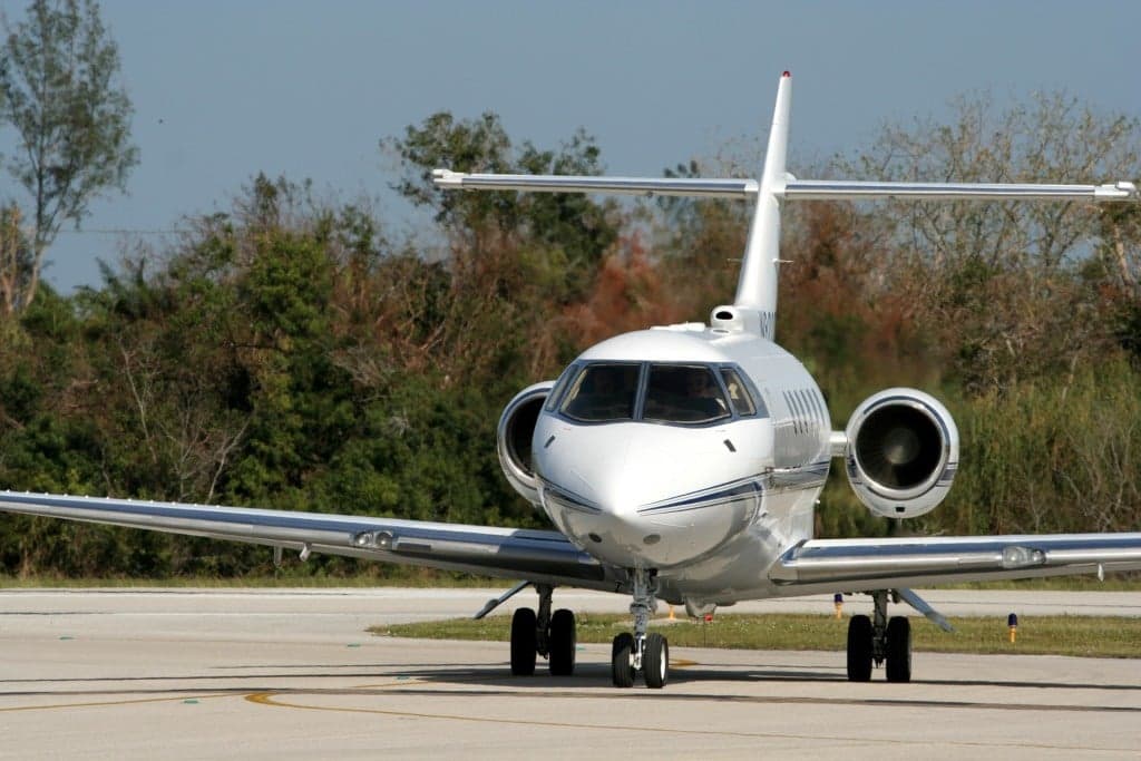 A Citation Latitude aircraft on the runway, front view.
