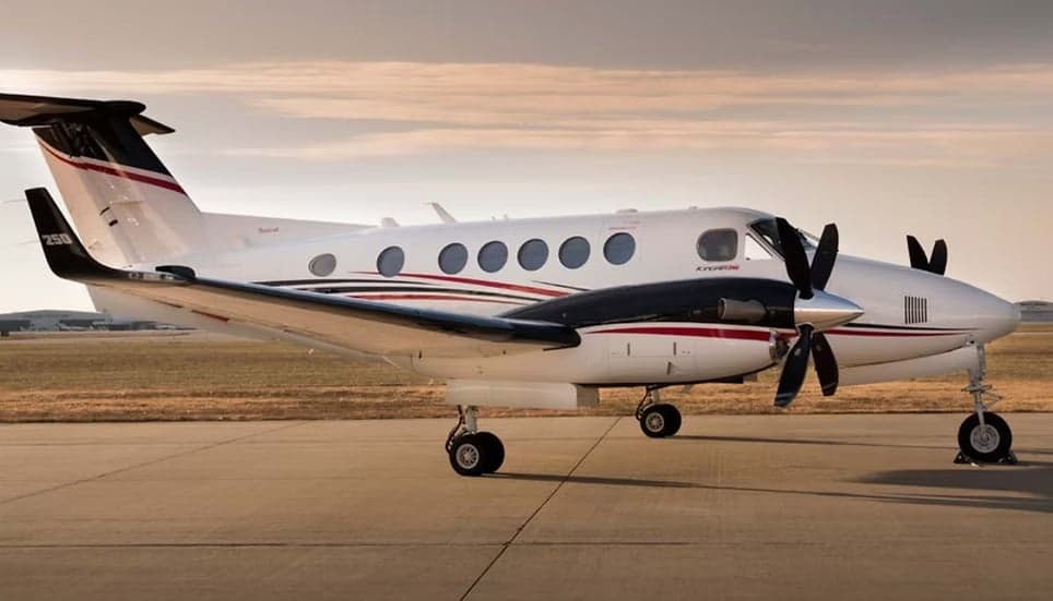 Side view of a King Air aircraft on the tarmac.